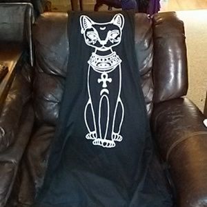 An Egyptian cat long sleeves dress with pockets.